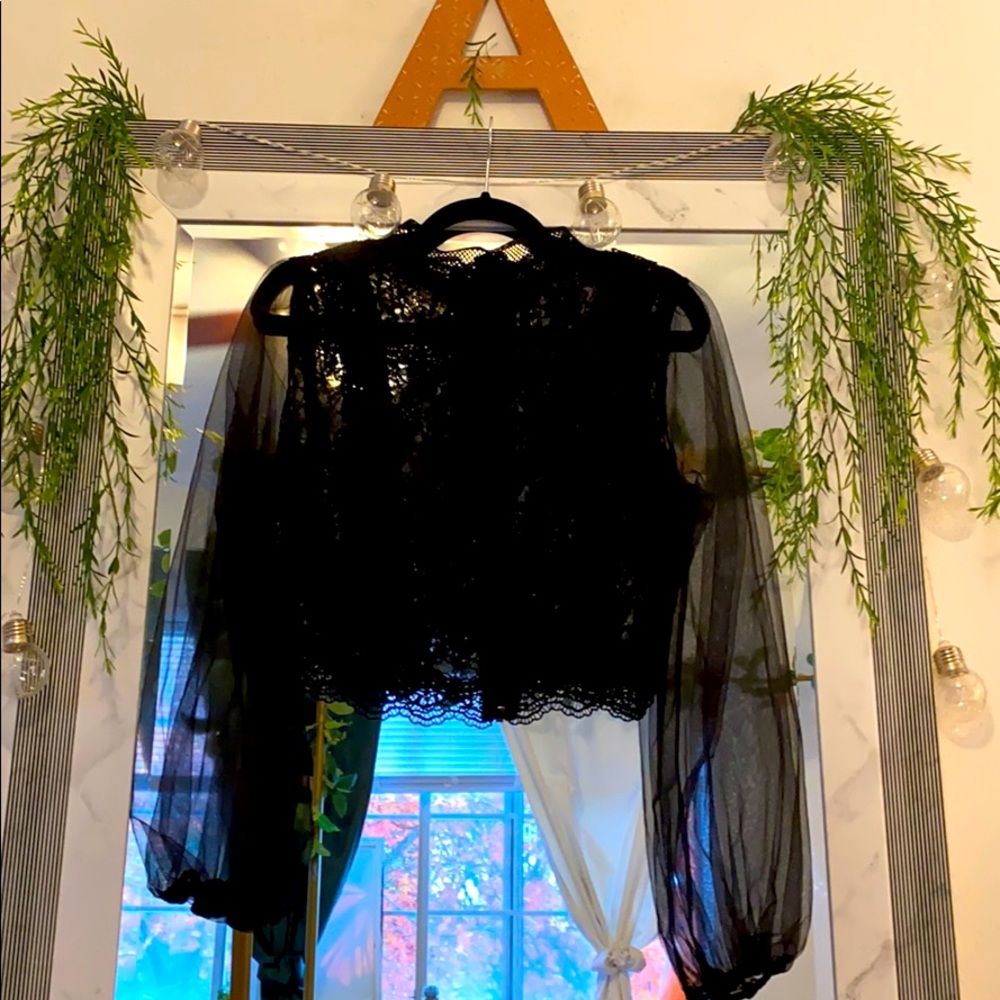 Black long sleeve crop style top.